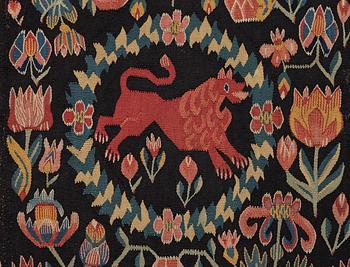 A cushion, 'Red Lion' (Rött Lejon), tapestry weave, c. 98 x 49 cm, Southwestern Scania, first part of the 19th century.