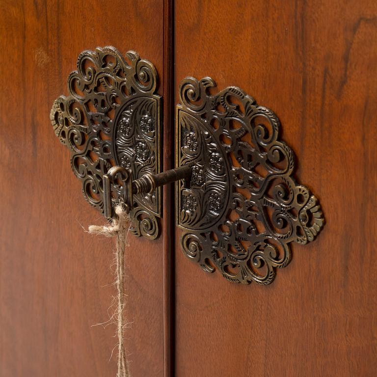 A mid 20th century walnut veneered bar cabinet.