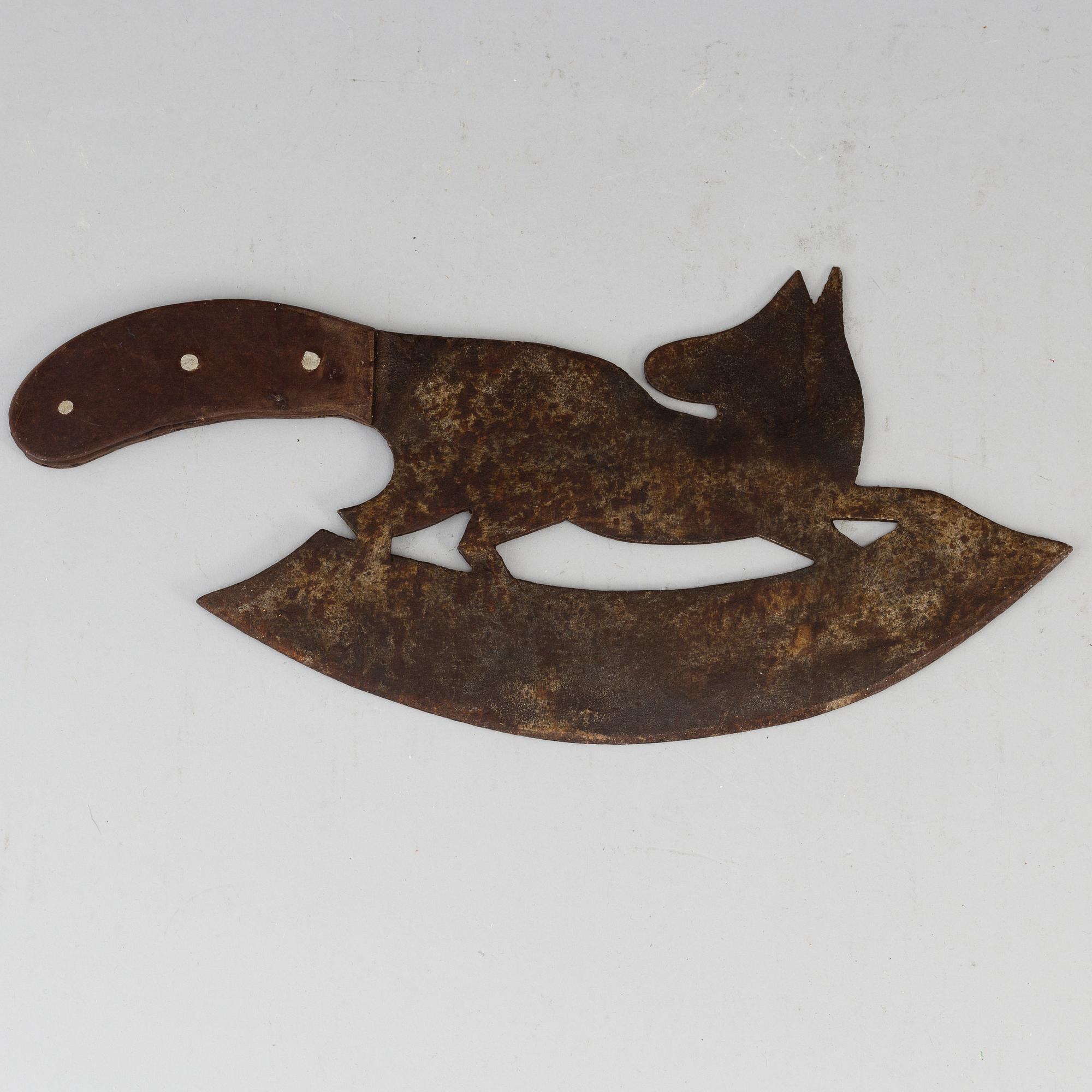 A 19th century iron meat cutter.