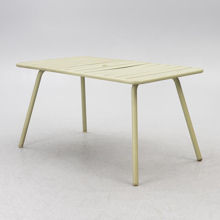 Frédéric Sofia, a table and two chairs for outdoor use, "Luxembourg" Fermob, France, 21st century.