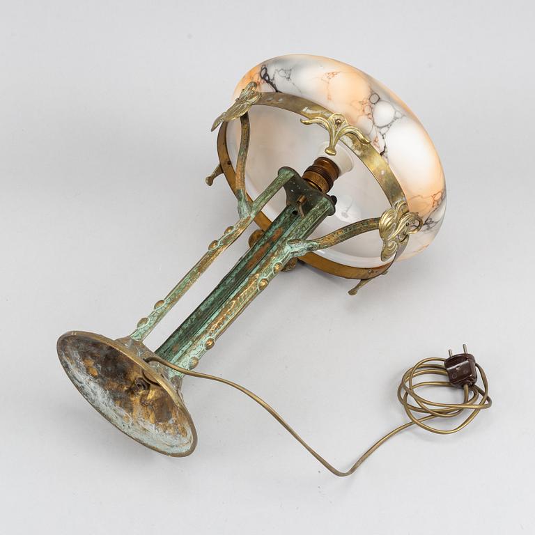 A brass and bronze Art Nouveau table lamp, early 20th century.