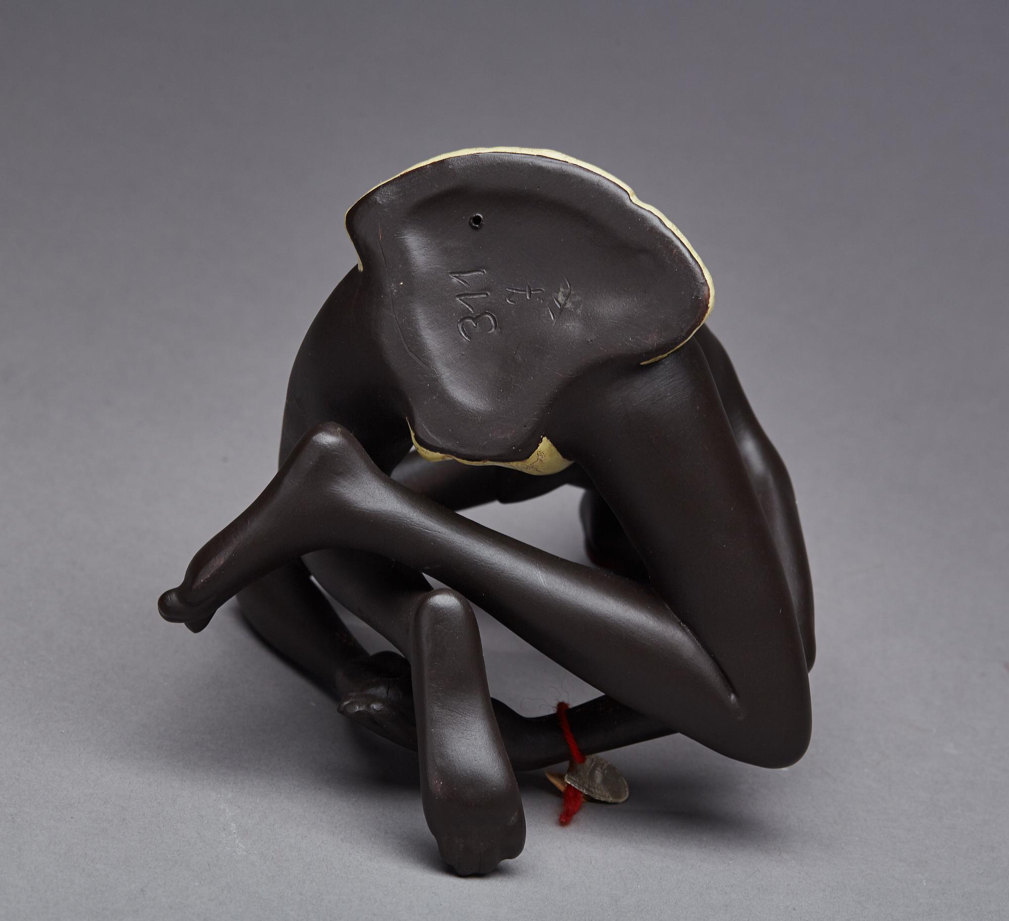 FIGURIN, etikettmärkt Goldscheider.
