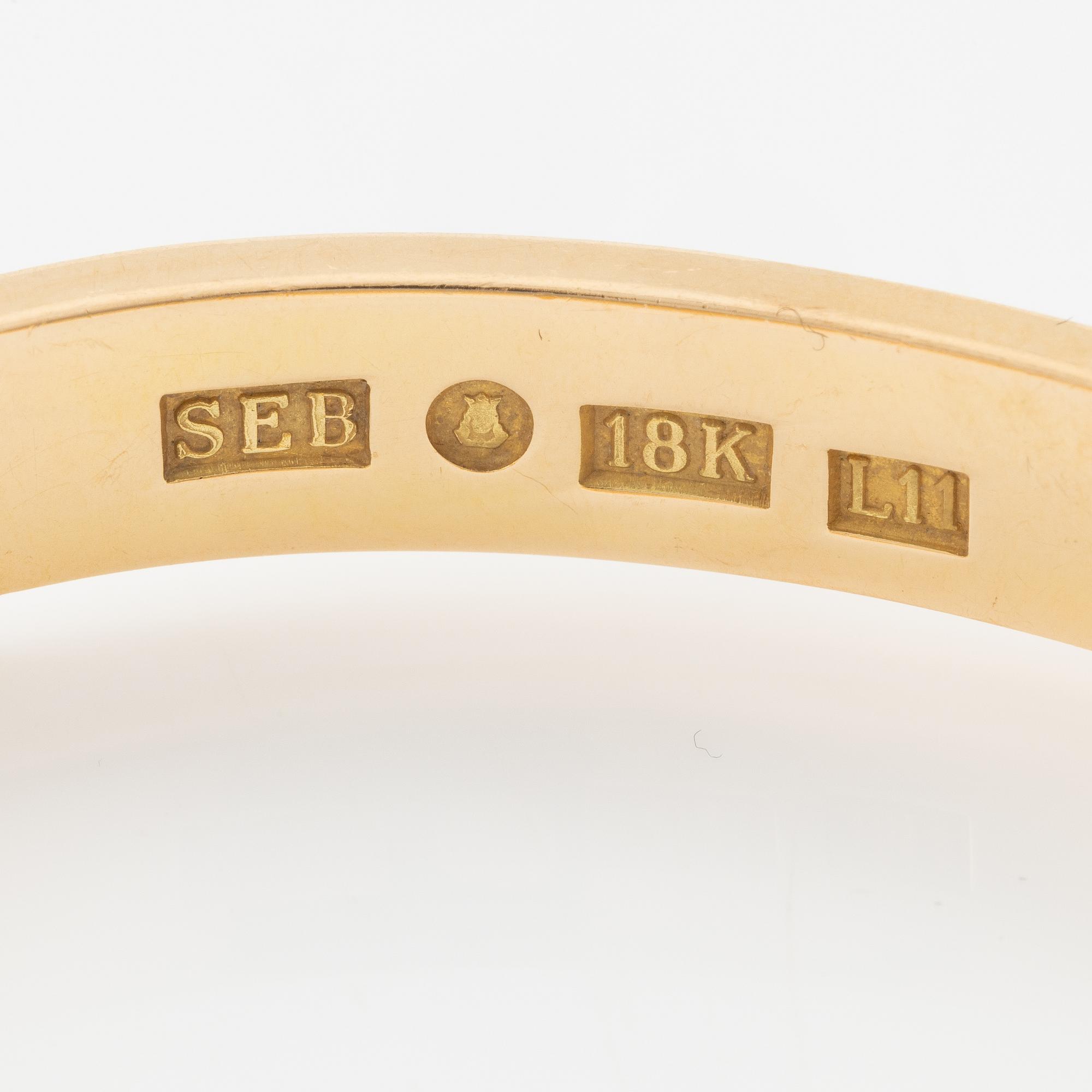 Bracelet, Sebastian Schildt, with a charm in the form of faces, probably Olle Ohlsson, 18K gold.