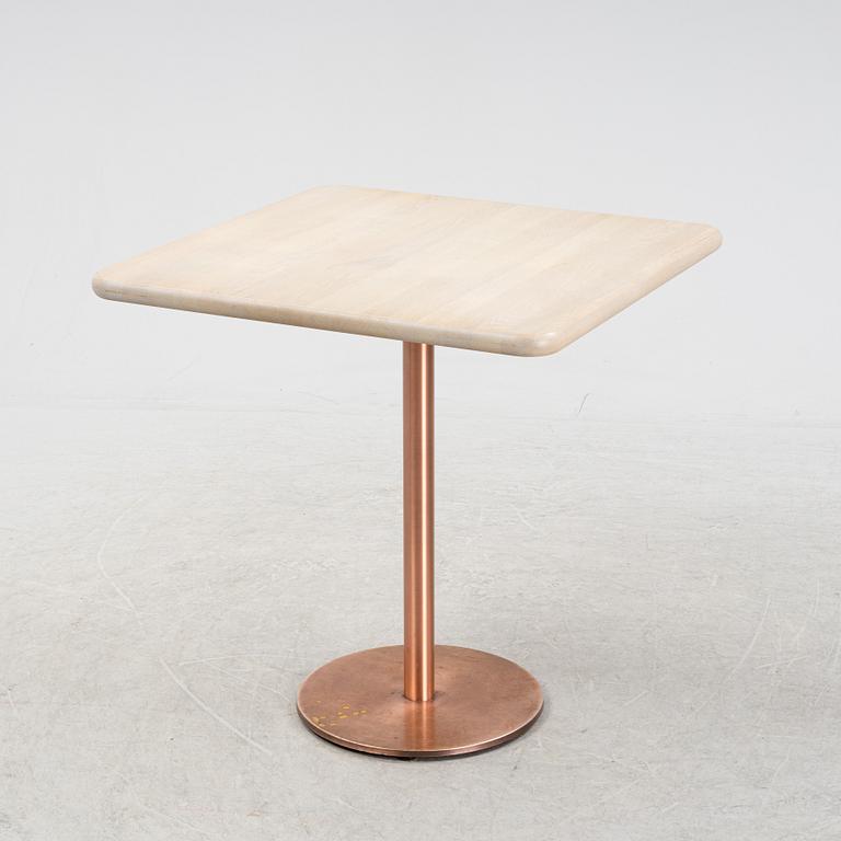 A steel and oak table by Jonas Lindvall Stolab, 2011.