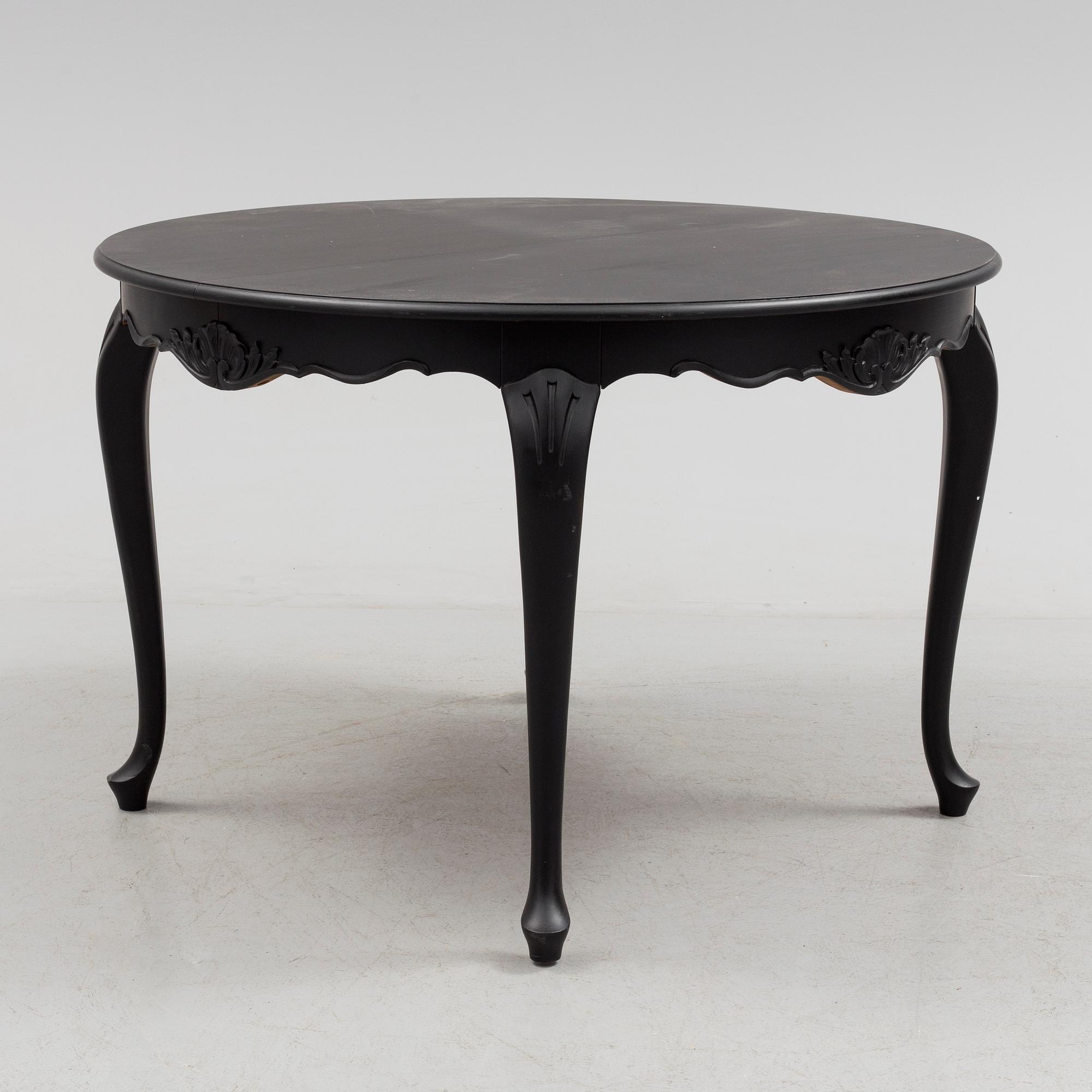 A mid 20th century rococo style dining table.