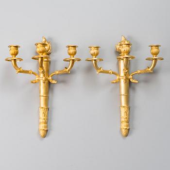 A pair of Empire wall candelabras in gilt bronze from the late 19th century.