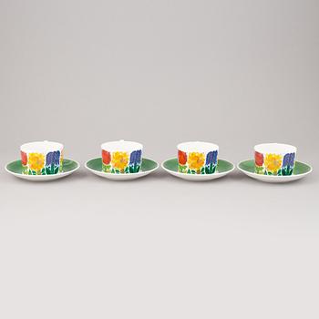 A set of four 'Tahiti' tea cups with plates by Stig Lindberg for Gustavsberg.