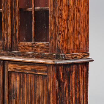 A Swedish faux-boix neo-gothic book cabinet, ca 1830.