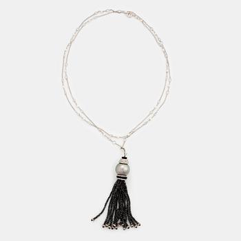 436A. An Ebba Brahe 18K white gold tassel pendant with a cultured Tahitian pearl and white and black diamonds.