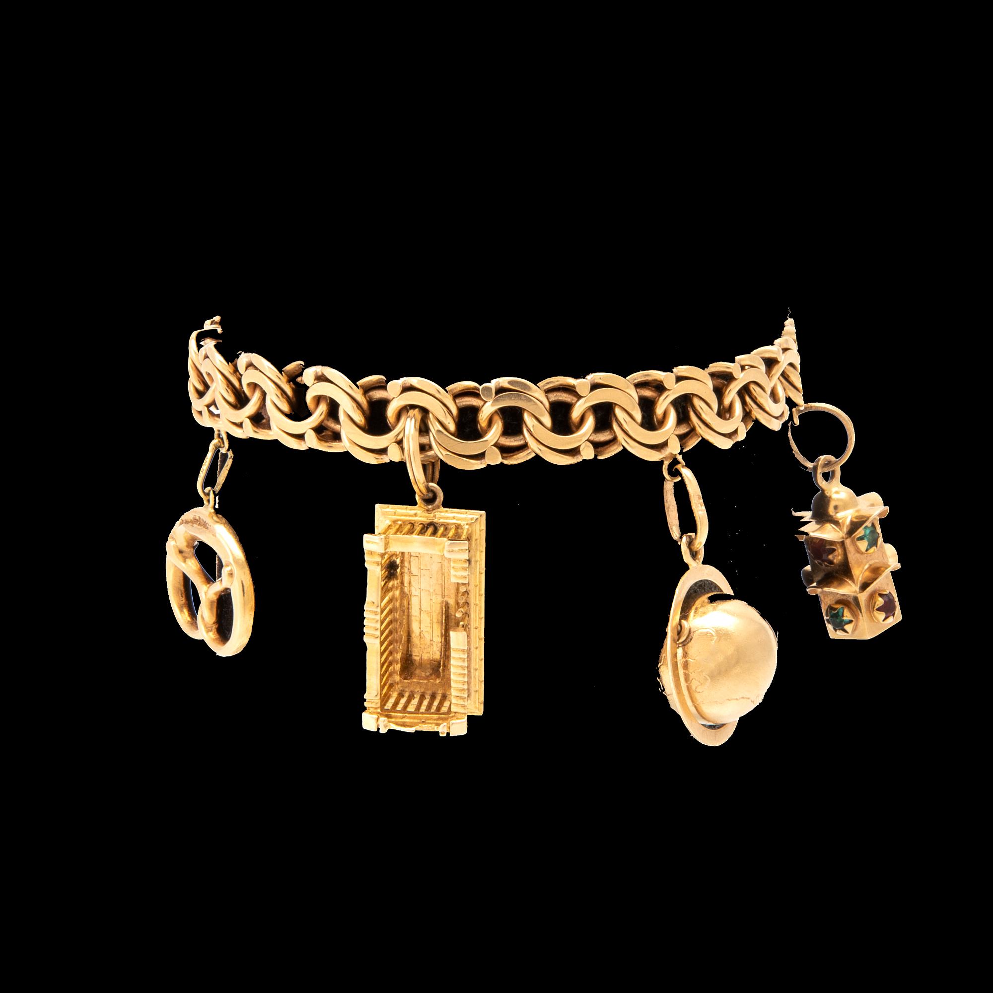 An 18K gold bracelet with charms.