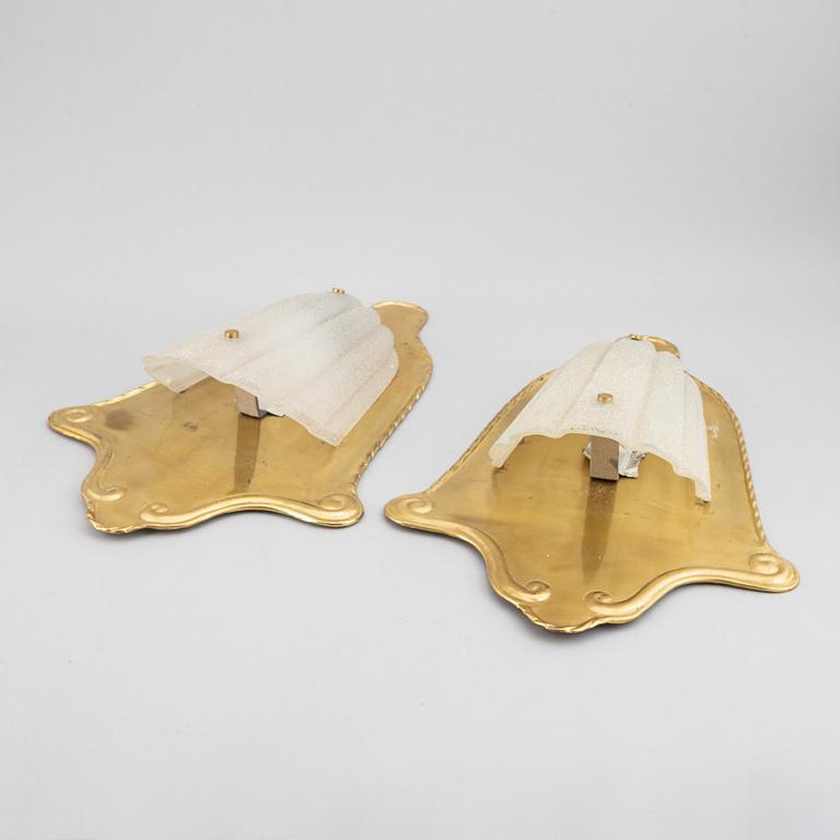 A pair of brass and glass wall lamps, 1940s.