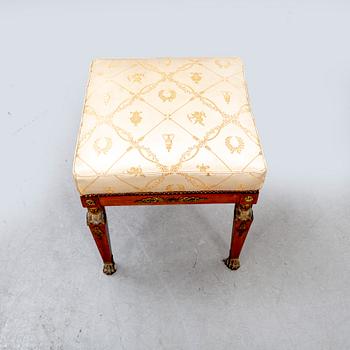 An Empire style mahogany stool around 1900.