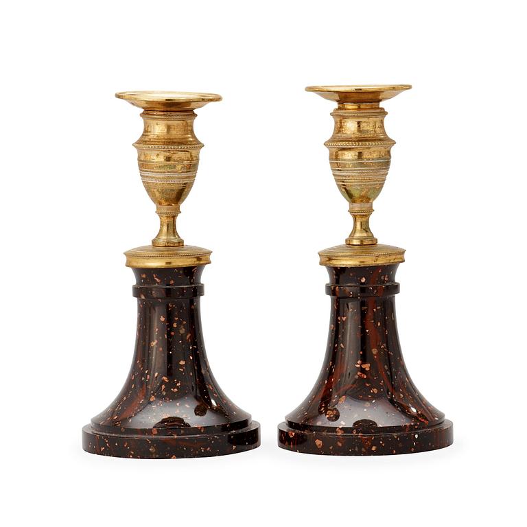 A pair of late Gustavian circa 1800 porphyry and gilt bronze candlesticks.