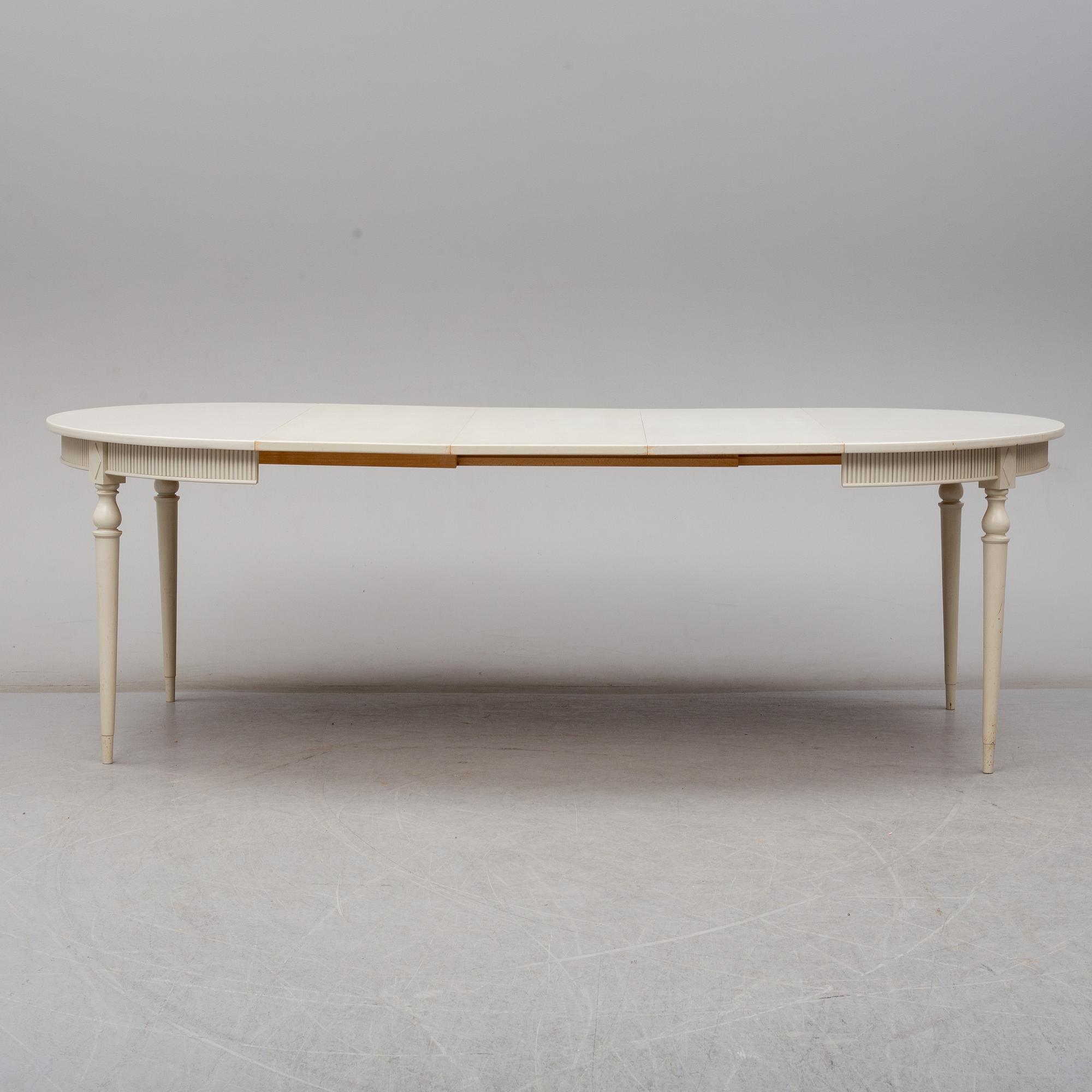 Four chairs with dinner table, late 20th Century.