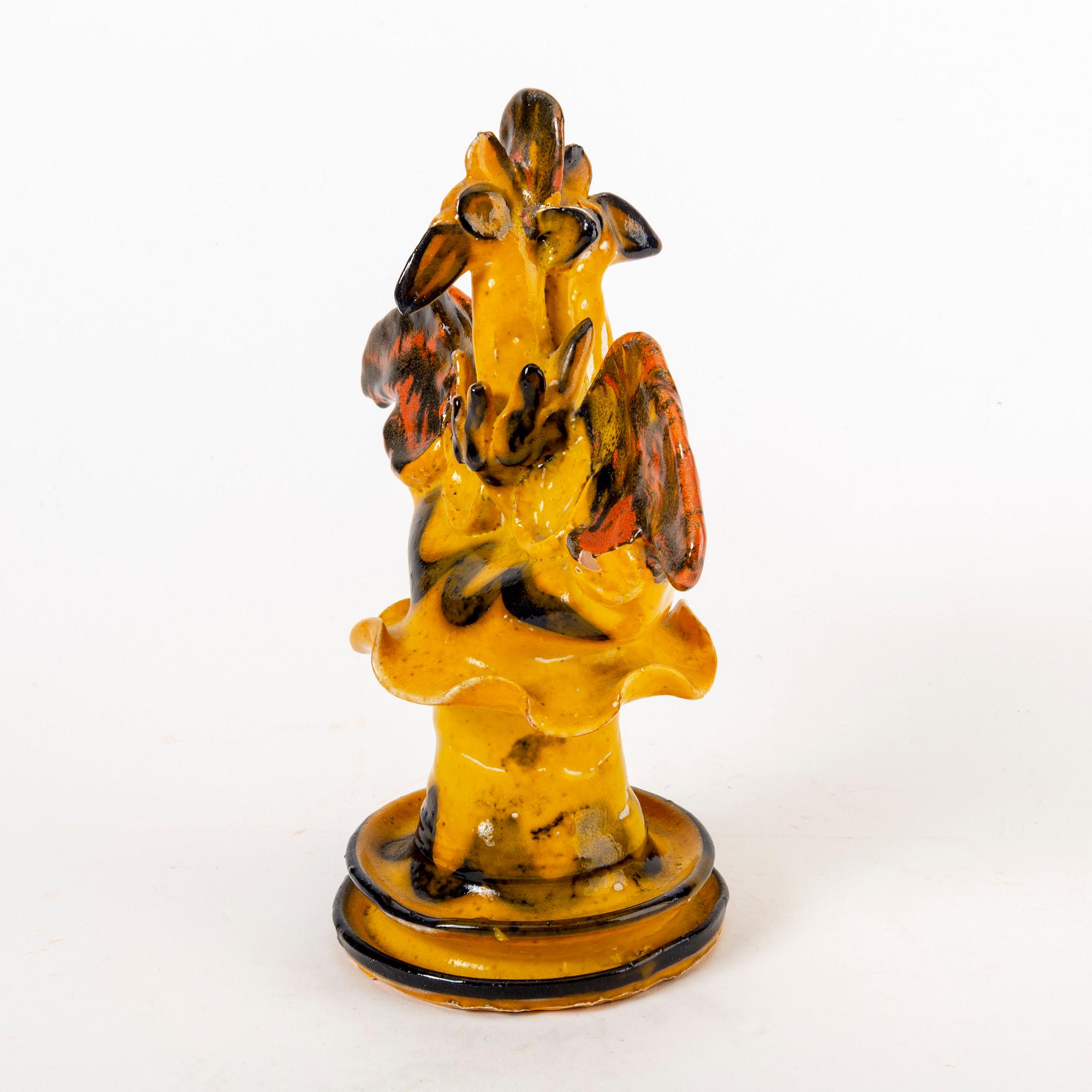 A signed Ulrica Hydman-Vallien stoneware figurine.
