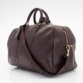 Louis Vuitton, a 'Taiga Kendall PM' weekend bag.