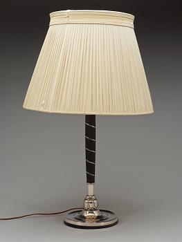 A C.G. Hallberg ebonized wood and silver table lamp, Stockholm 1928.