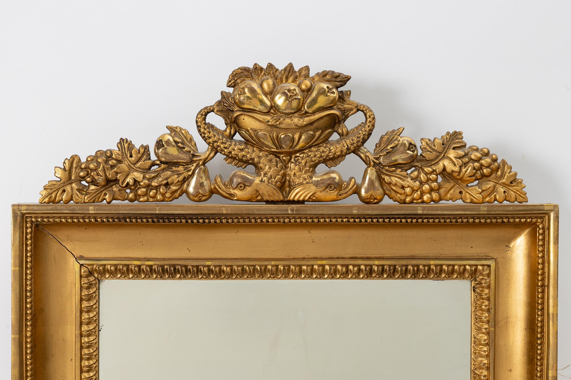 A pair of Empire giltwood two-branch girandole mirrors, Sweden, first part 19th century.