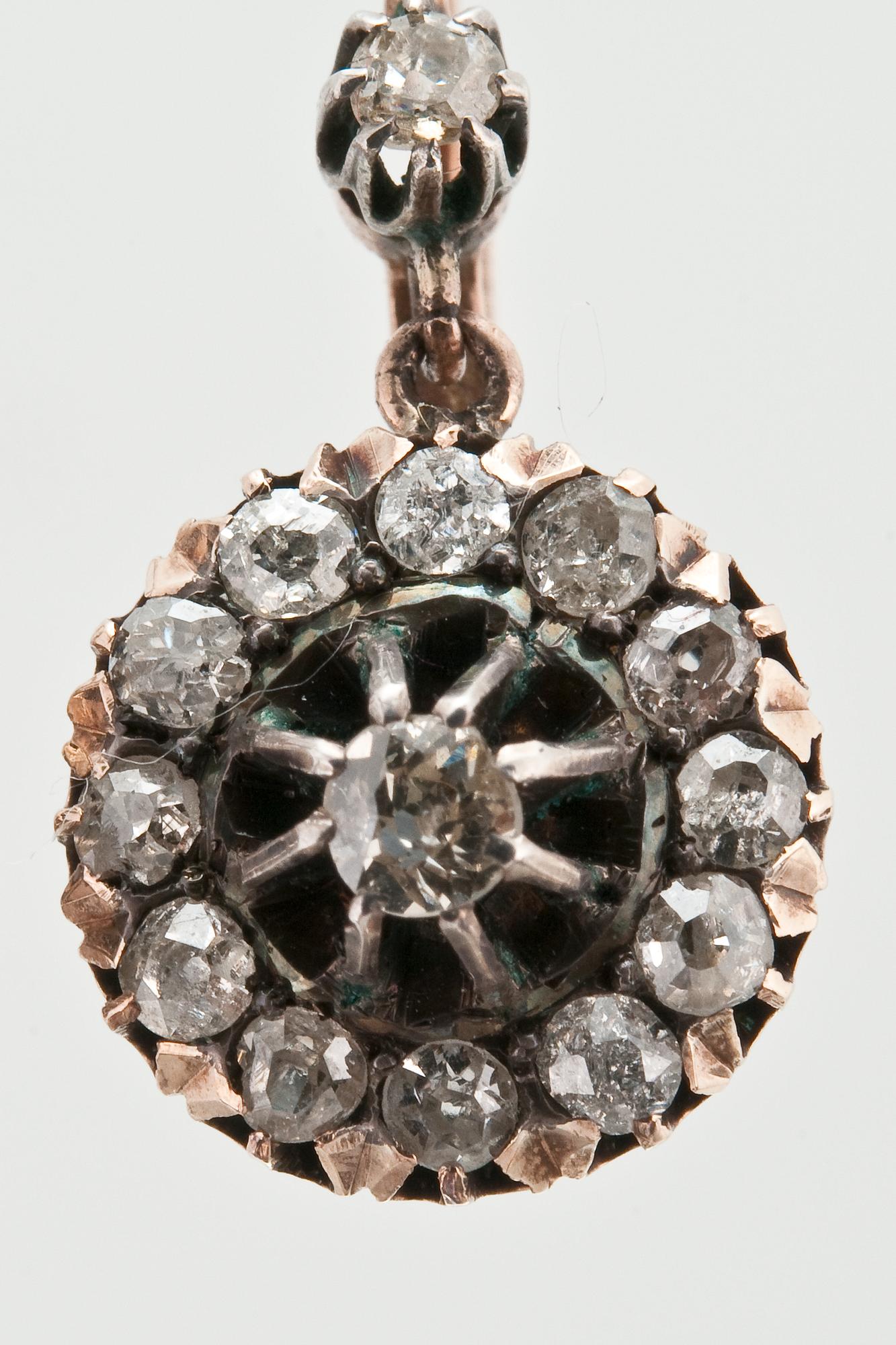 A PAIR OF DIAMOND EARRINGS.