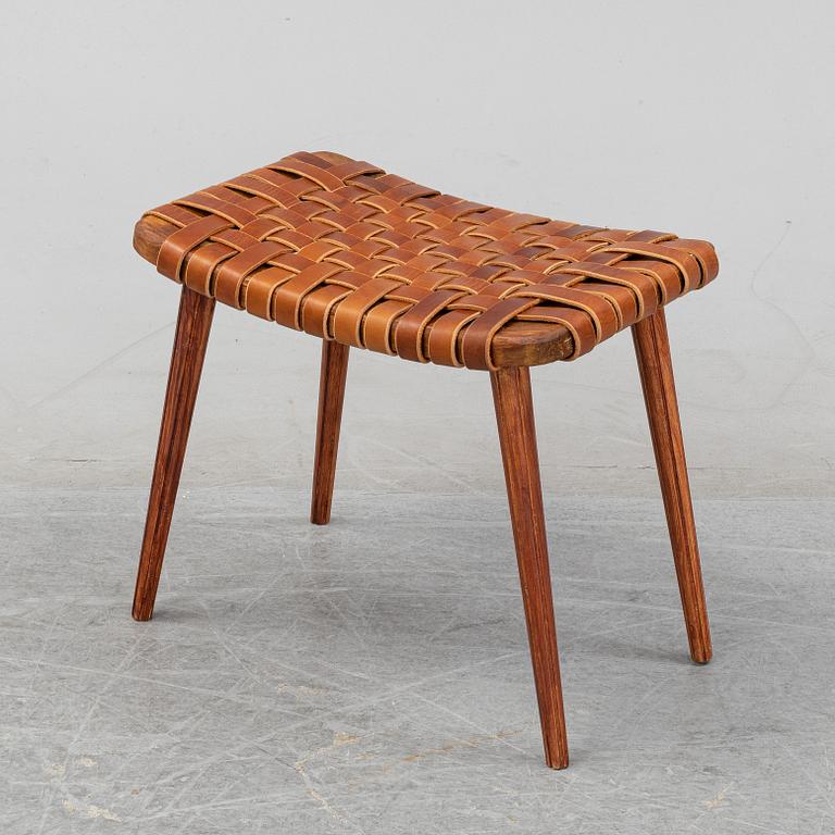 A leather upholstered stool, 1950's.