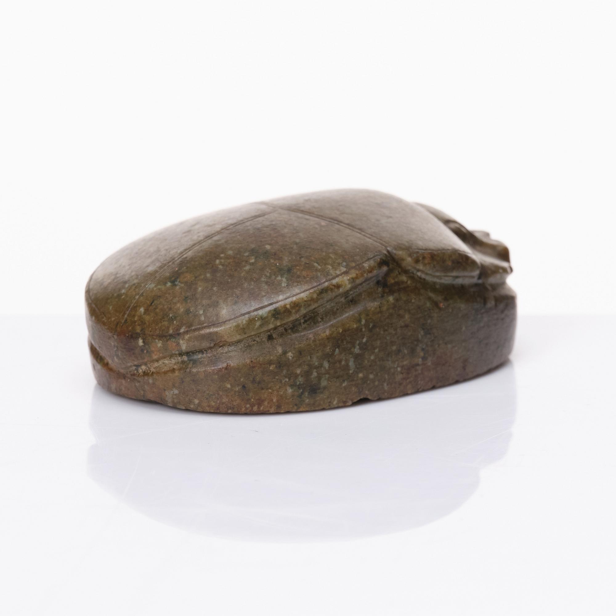 An Egyptian hardstone funerary scarab, probably Late Period, 26th-30th Dynasties, circa 664-343 B.C.