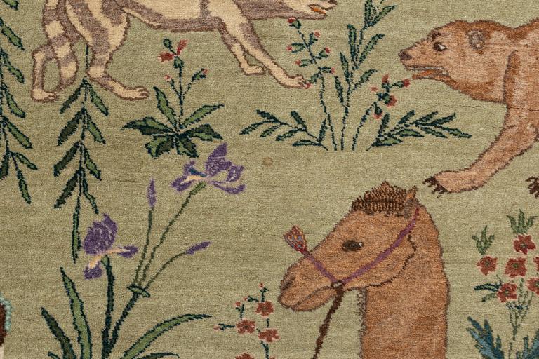 A carpet, semi-antique, Tabriz, signed, ca 271 x 175 cm.