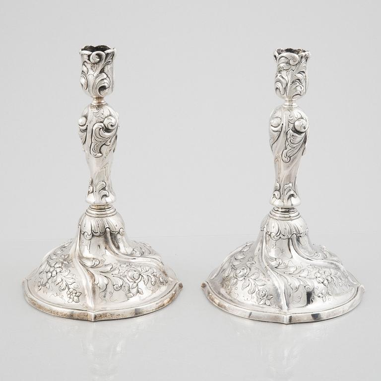 A pair of Rococo style sterling silver candelsticks, Swedish import mark.