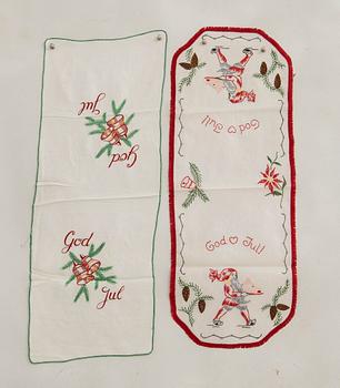 A collection of smaller Christmas tablecloths, runners, and wall hangings, approximately 34 pieces, mid/second half of the 20th century.