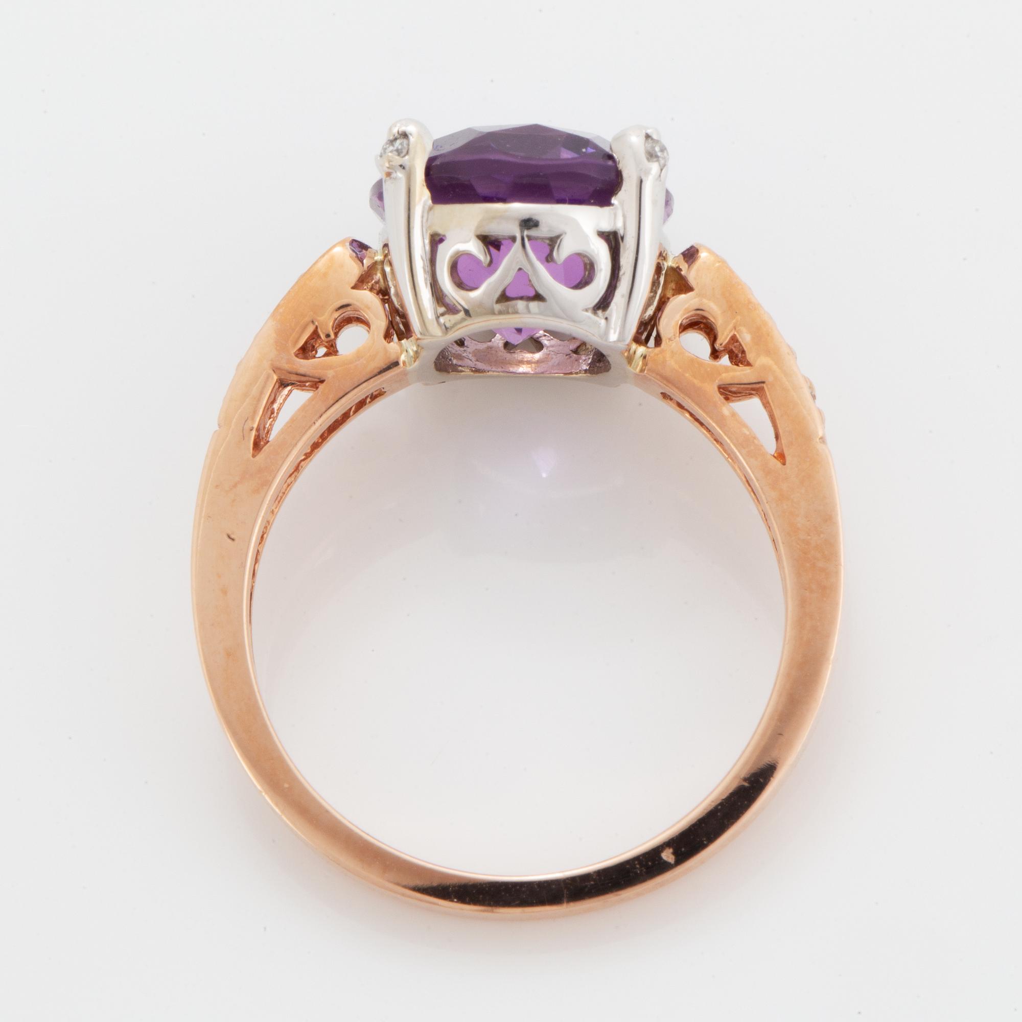 Oval faceted amethyst and brilliant-cut diamond ring.