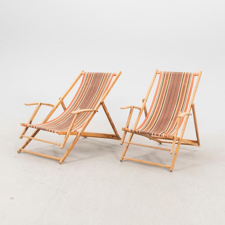 A pair of mid 1900s sun chairs.