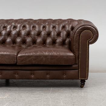 A modern chesterfield sofa.