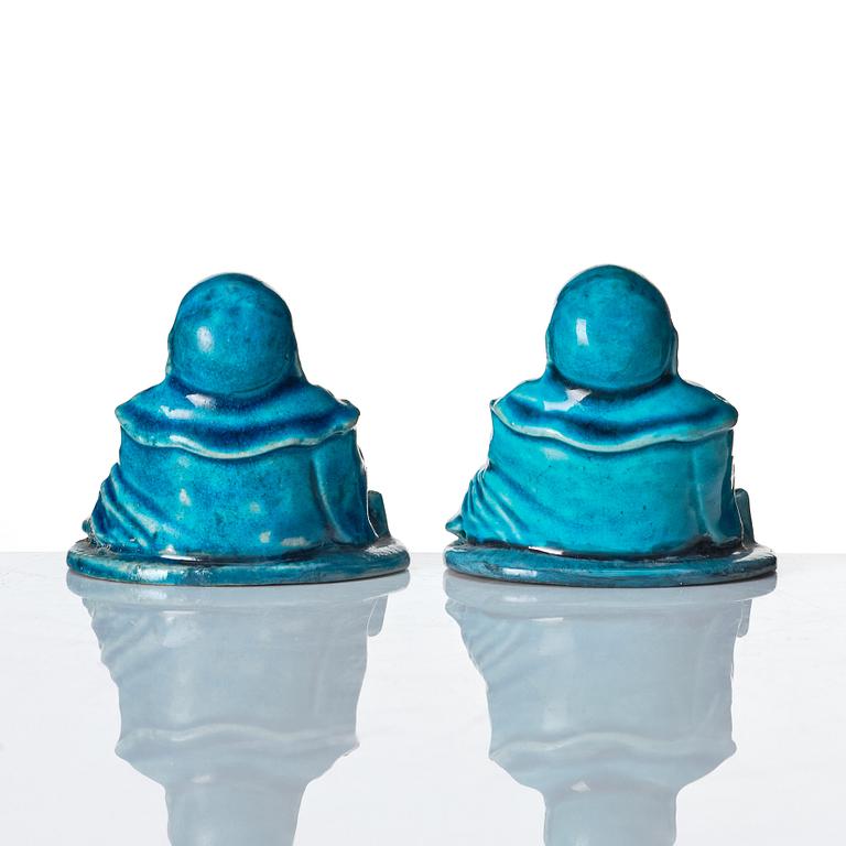 A pair of turquoise glazed joss stick holders in the shape of Buddai, Qing dynasty, 18th Century.