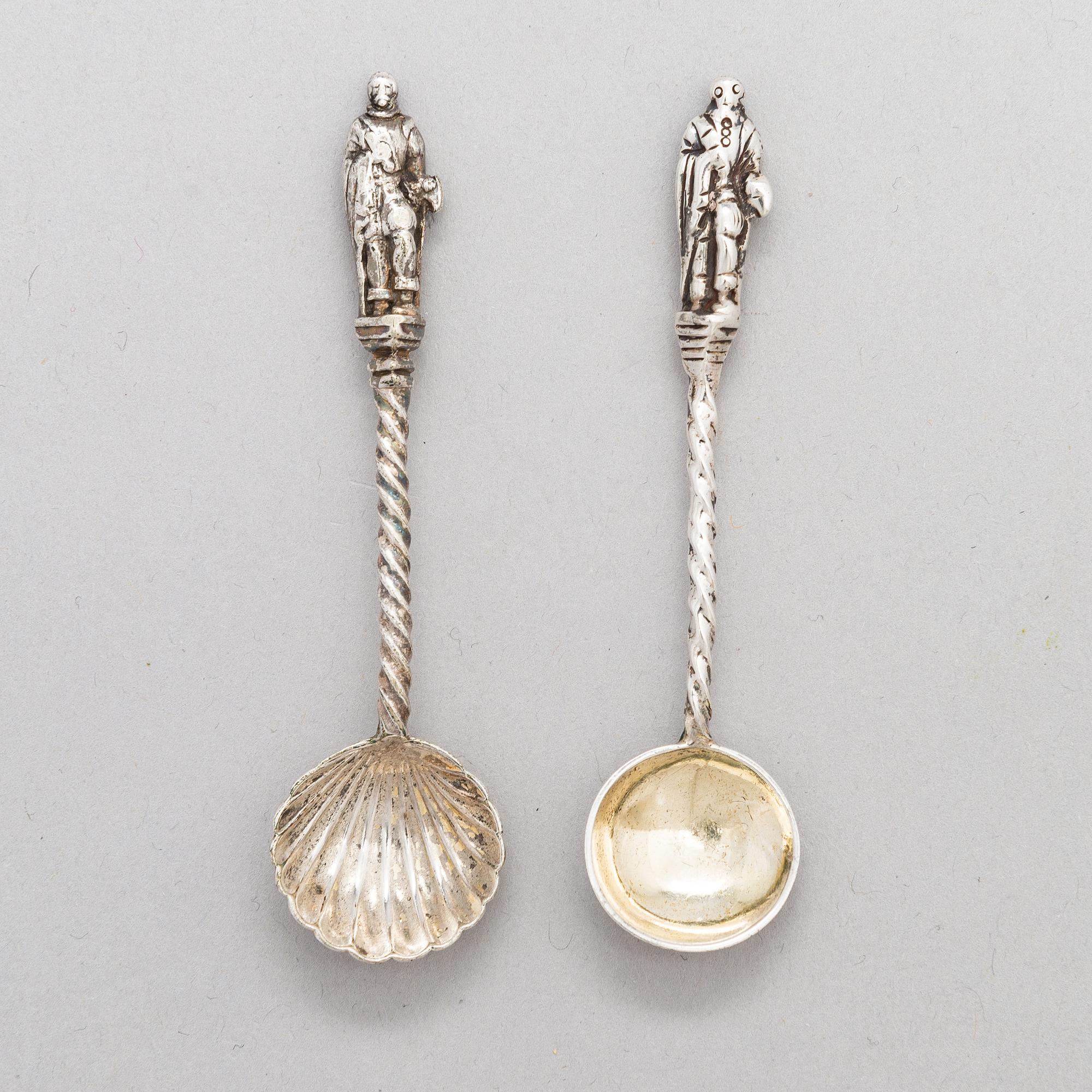 A pair of silver saltcellars, maker's mark of John Edward Wilmot, Birmingham year 1900, and two silver salt spoons.