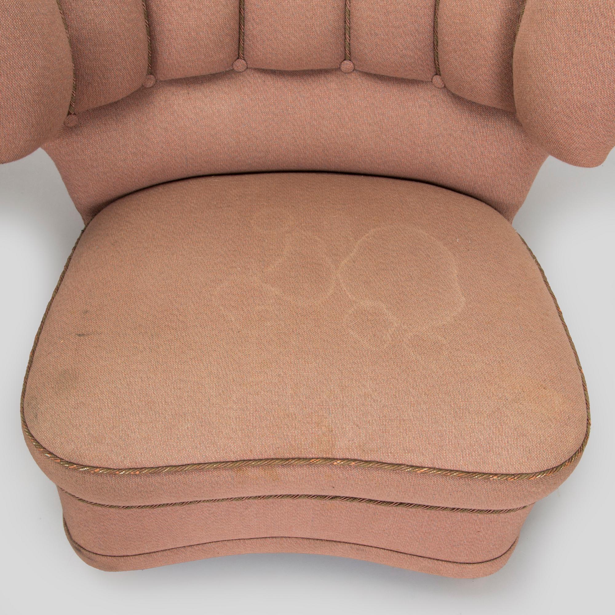 A pair of mid-20th century armchairs.