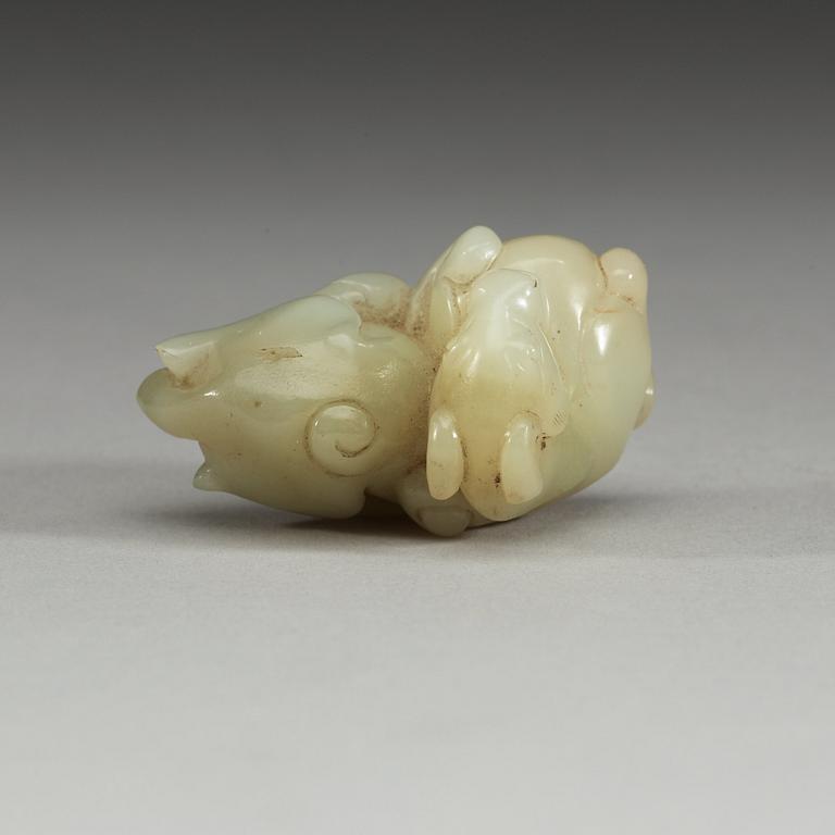 A Chinese nephrite figure of a reclining horse.