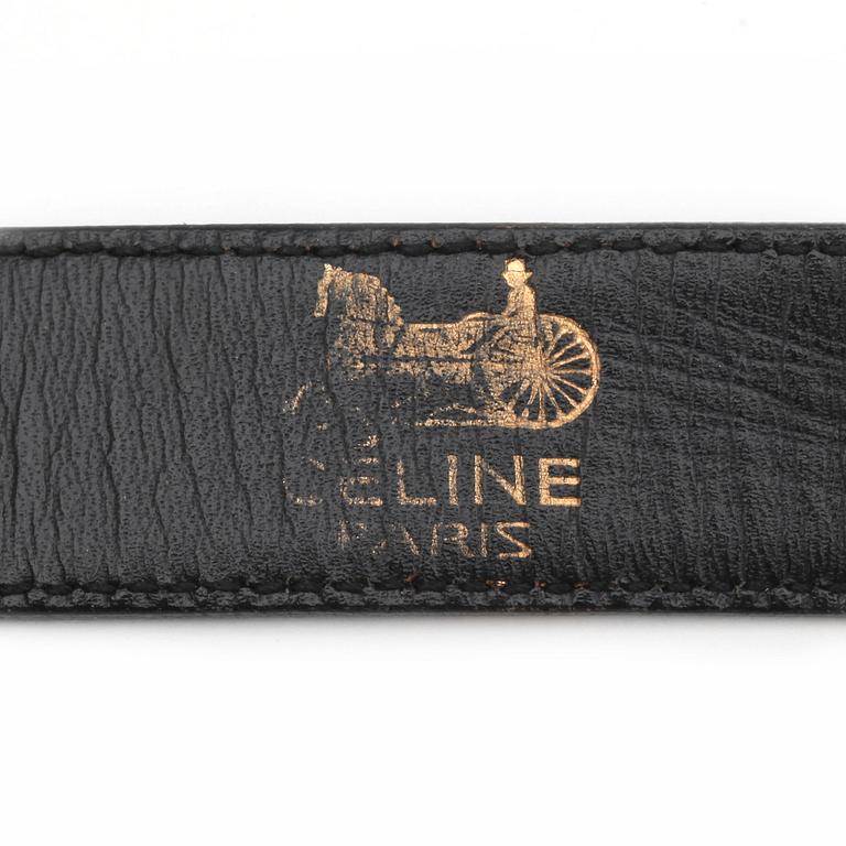 CÉLINE, a black leather belt.