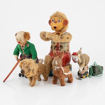A set of five toys, including 'Rolly' clown from Schuco, 20th century.