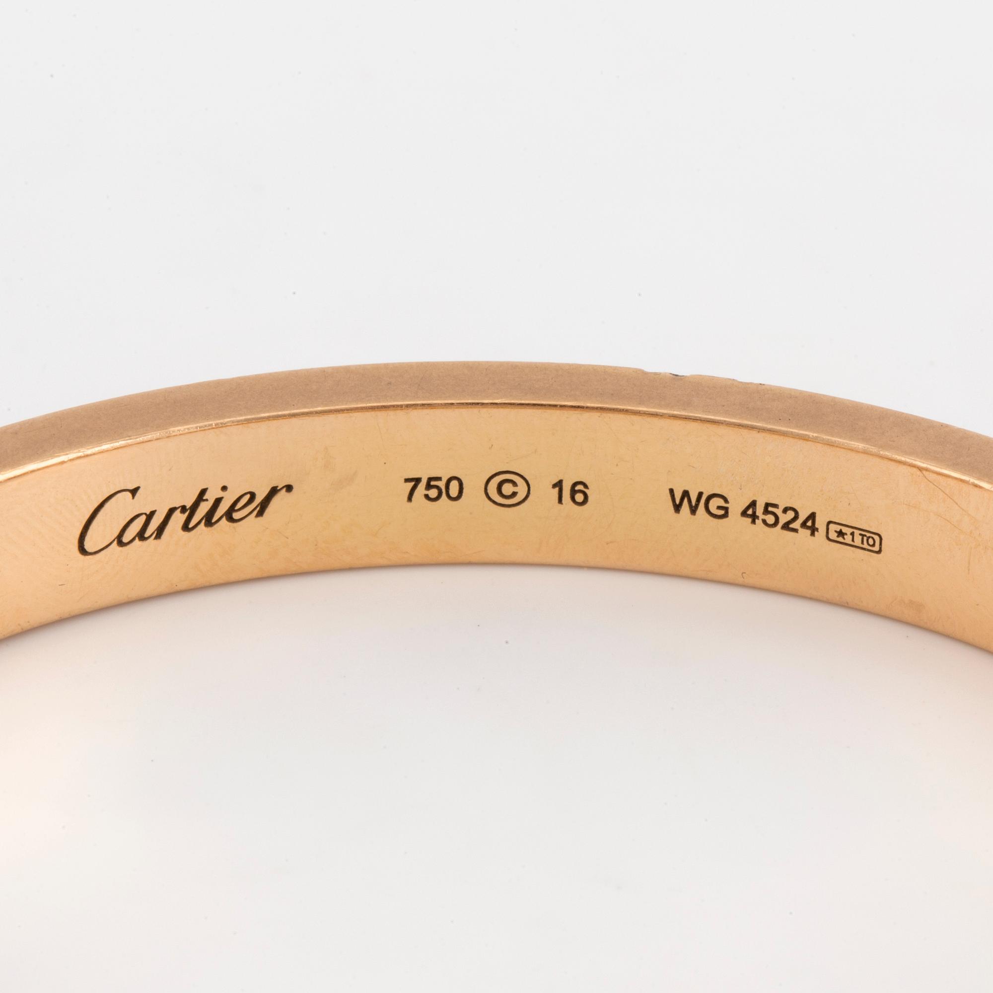 A Cartier 'LOVE' bangle set with round, brilliant-cut diamonds.