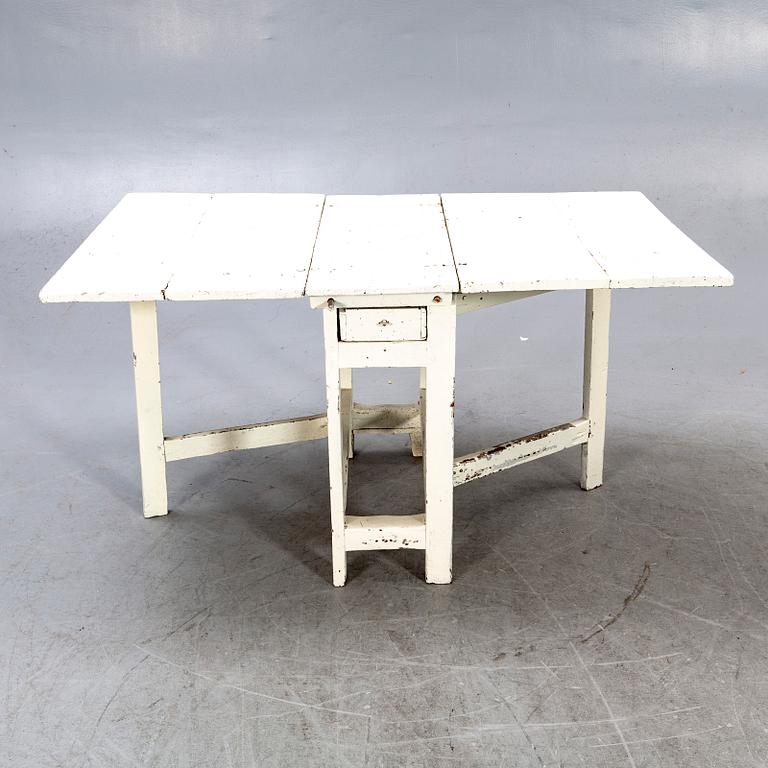 A painted late 19th century folding table.