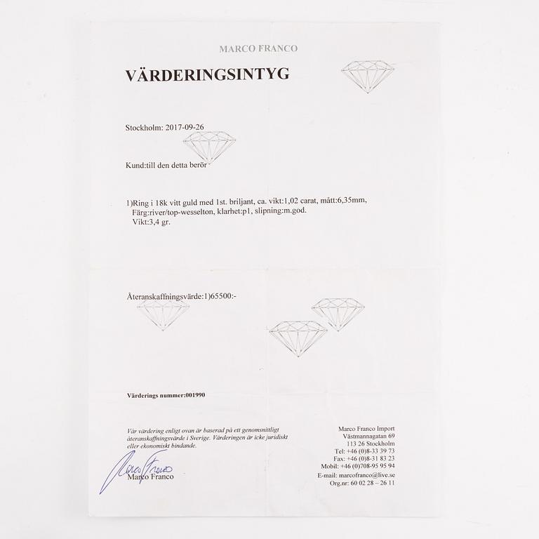 Ring 18K vitguld med briljantslipad diamant.