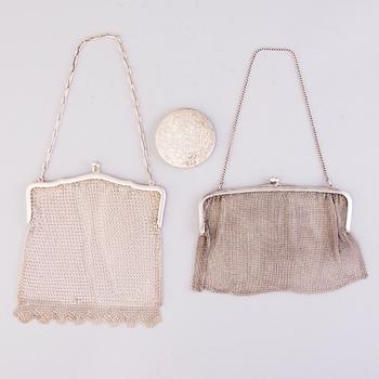 Two silver evening bags and a silver mirror, 1920s-1940s.