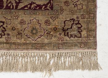 A Hereke silk rug, c. 78 x 57 cm.