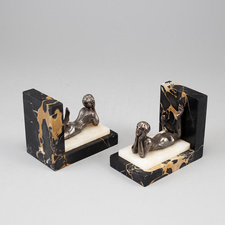 A pair of marble and silver plate art déco book ends.