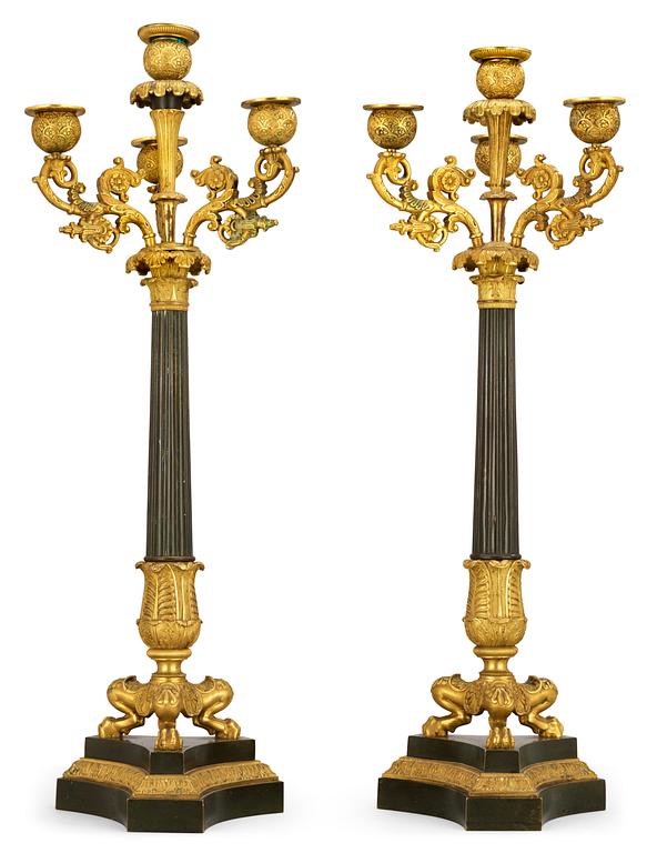 A pair of French Empire early 19th century four-light candelabra.