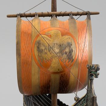 A min 20th century model of a viking ship, brass and copper.