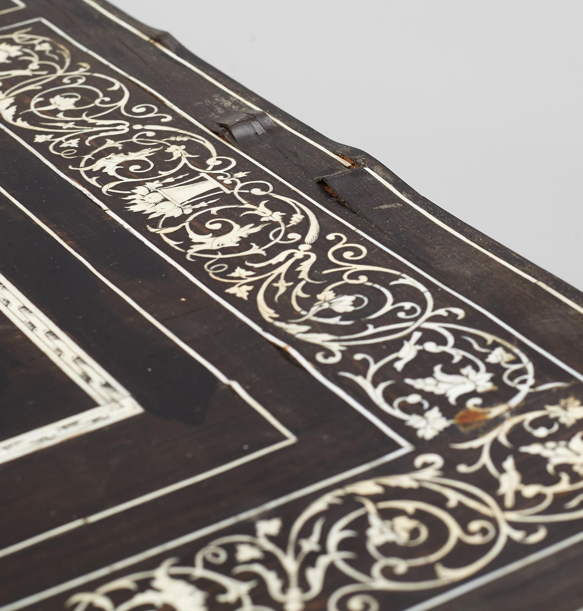 A Renaissance-style ebony, ebonized and ivory-inlaid library table, late 19th century, presumably Germany.