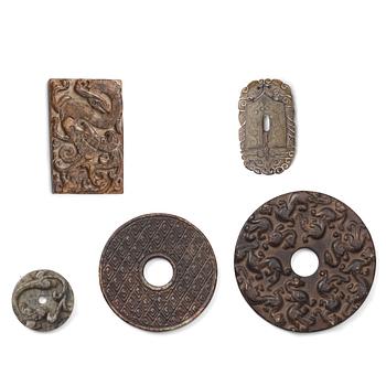 673. A group of three archaistic Chinese stone bi discs and two pendants.