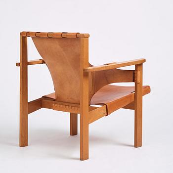 Carl-Axel Acking, an oak and brown natural leather 'Trienna' chair, Nordiska Kompaniet, Sweden.