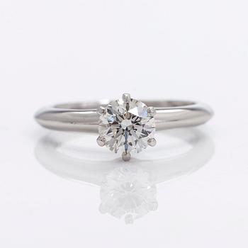 Tiffany & Co, a platinu solitaire ring with a brilliant-cut diamond.