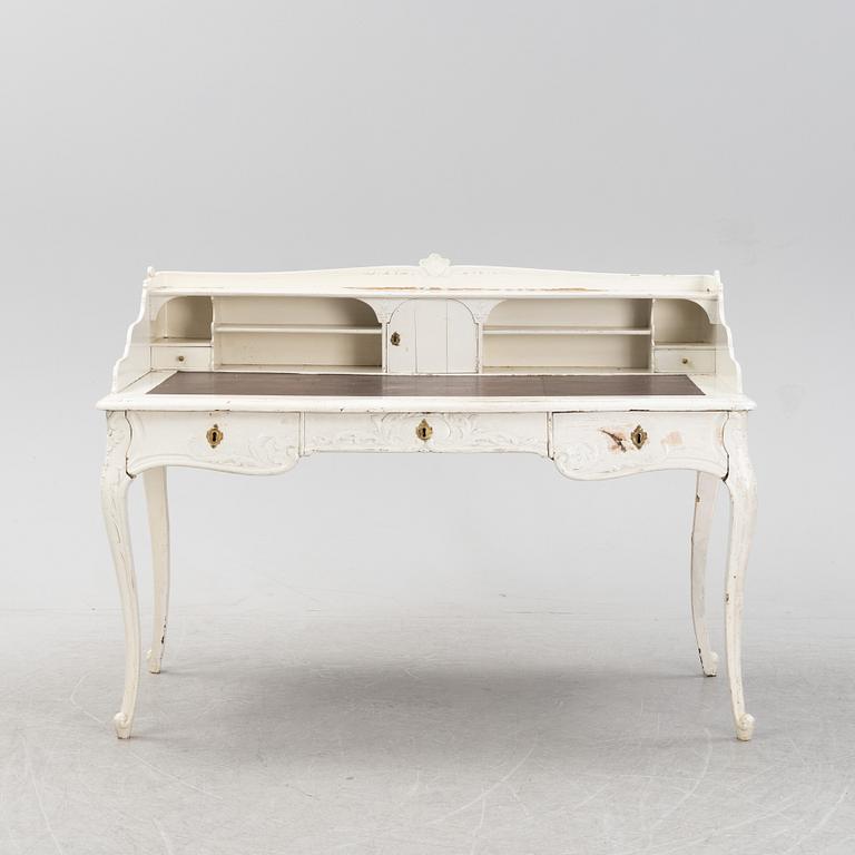 A painted rococo writing desk, mid 18th Century with later parts.